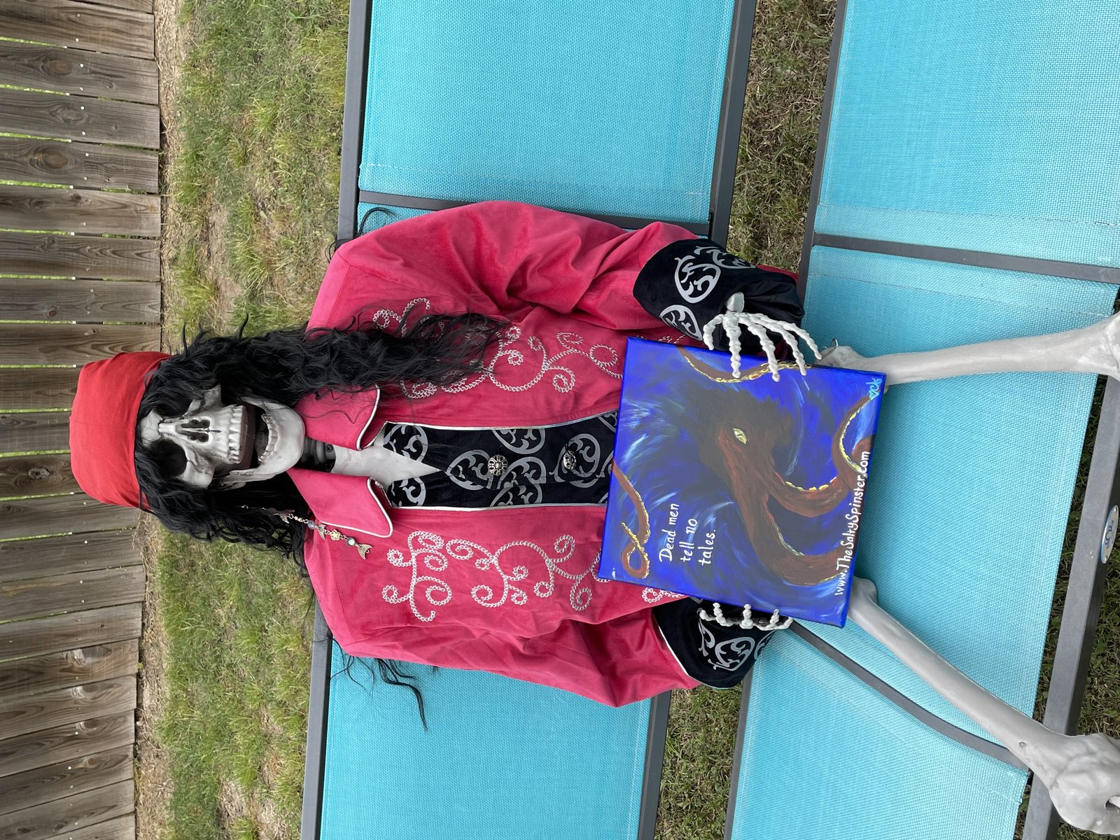 The Dead Pirate Robert. Head of Advertising with his painted sign for my shop.