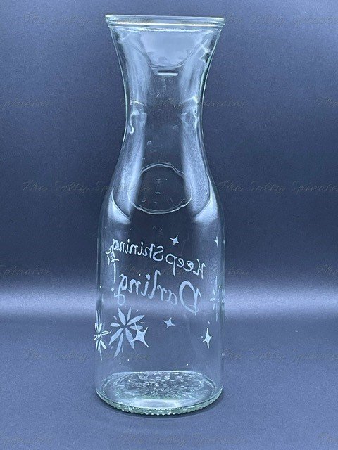 Back side view of hand etched water pitcher showing more etched stars.